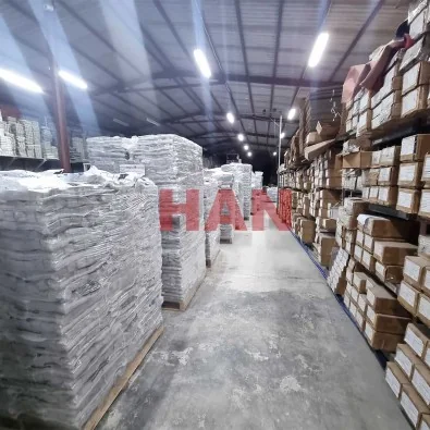 Kho thành phẩm HAN Corporation — pallet hàng xếp lớp trong nhà xưởng